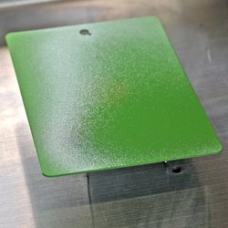 A green sheet metal with powder coating in the process of gelling and curing by Laserline diode lasers