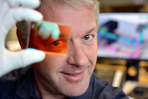 Laserline assistant investigating marine organisms on a test glass in a laboratory by Laserline diode lasers