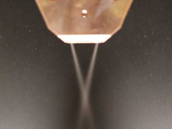 Closeup of the laser stream of an optic with a wide stream nozzle by Laserline diode lasers