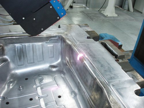 Workpiece moulded into a car body with efficient laser heat treatment by Laserline diode lasers