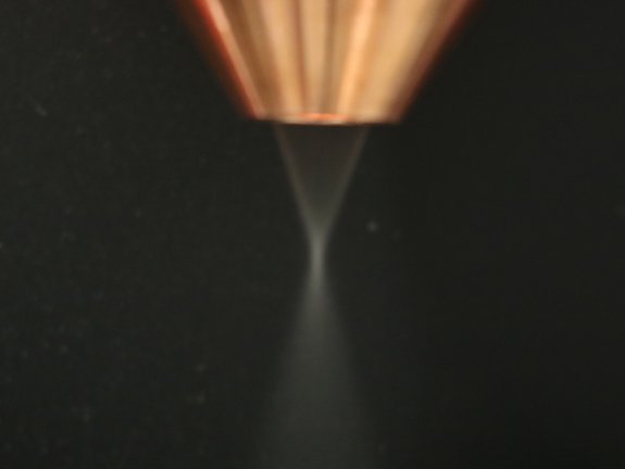 Closeup of the laser stream of an optic with a ringslit nozzle by Laserline diode lasers